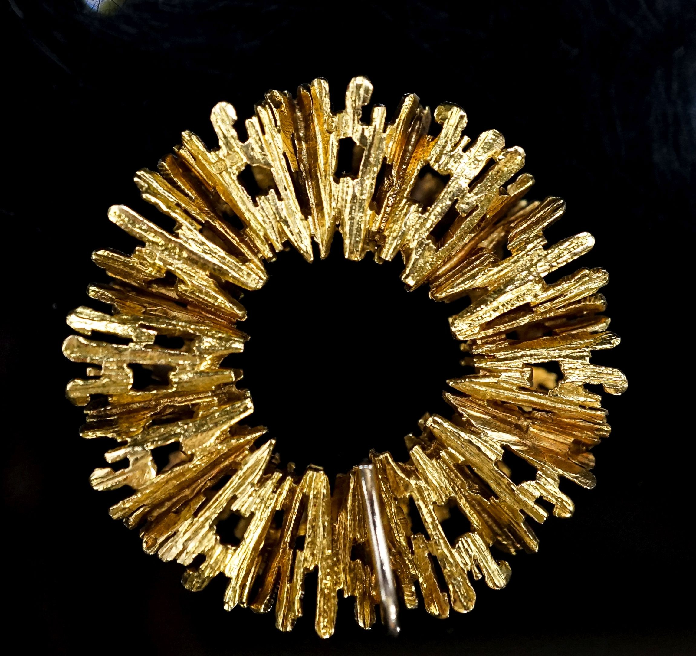 A 1970's textured 18ct gold modernist circular pendant, 35mm, 16 grams.